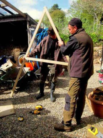 Permaculture surveyors build an A-frame